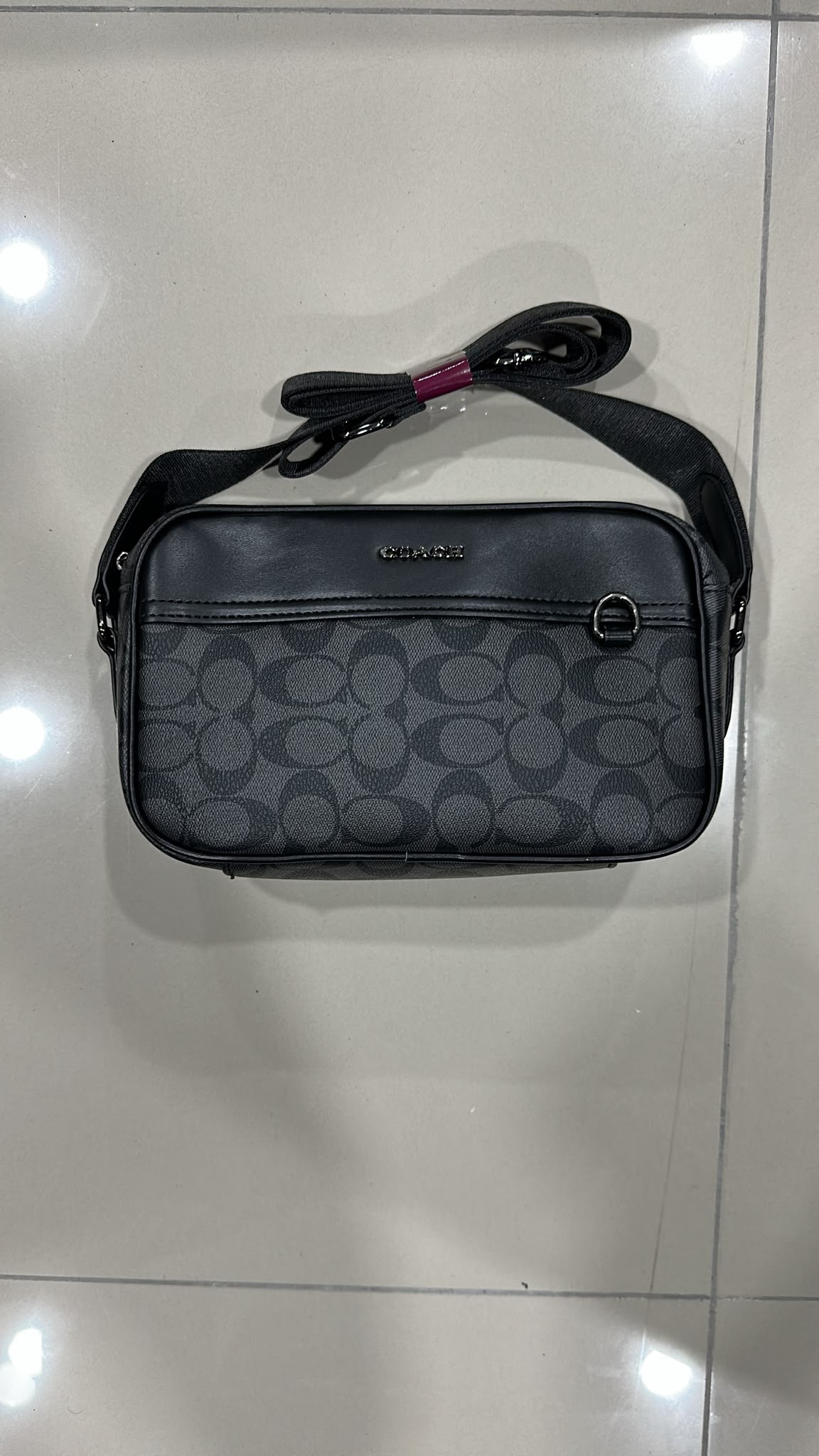 Coach negra gris